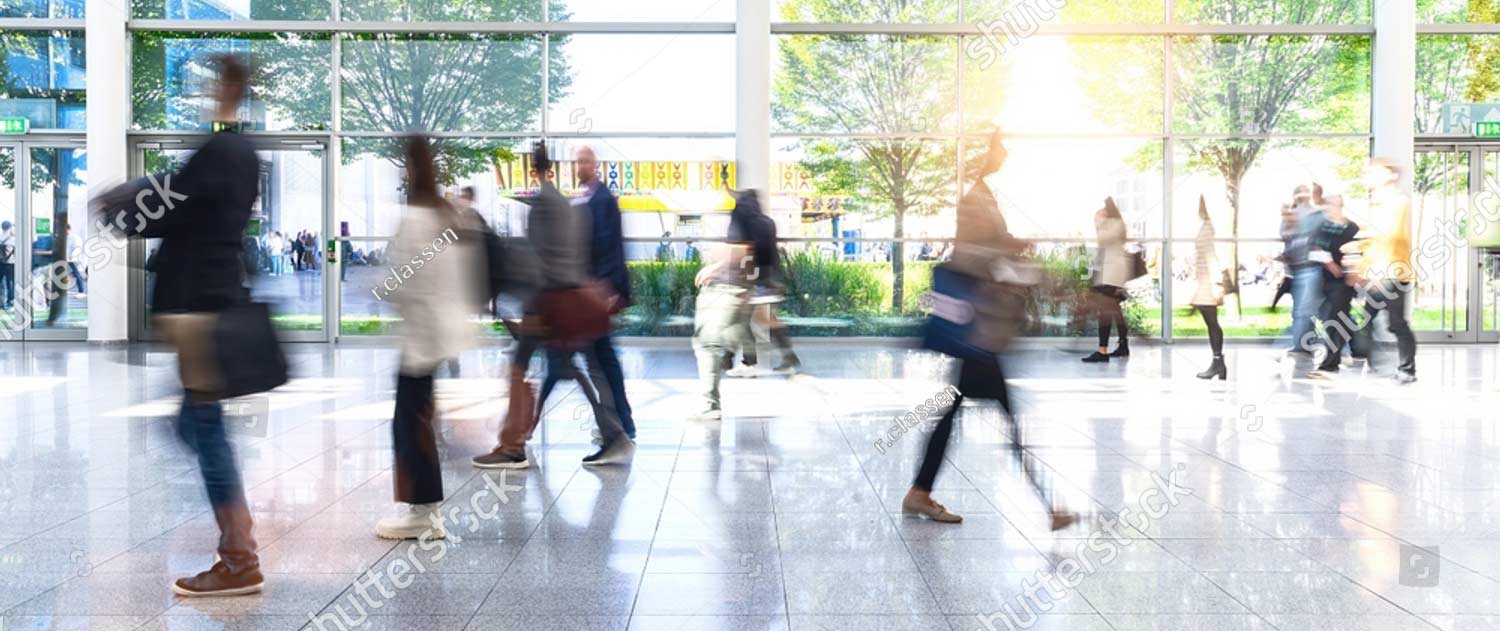 stock photo anonymous crowd goes by trade fair or airport through a corridor 2249464515 stock photo anonymous crowd goes by trade fair or airport through a corridor 2249464515